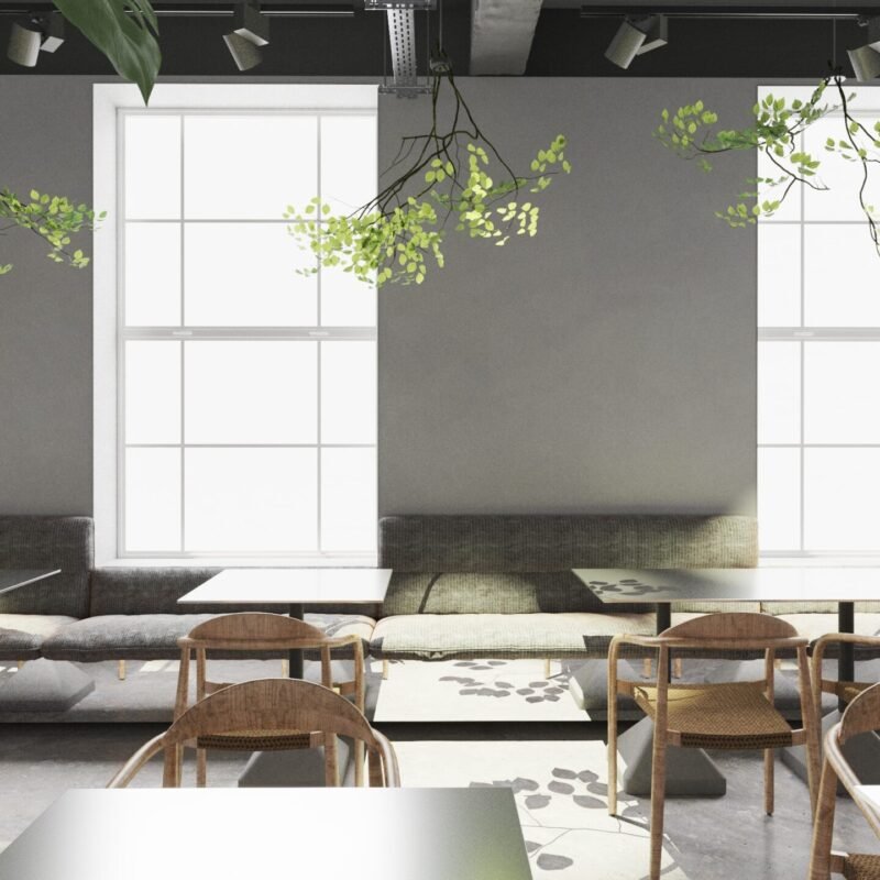 Mese din aluminiu și scaune metalice, combinate cu plante naturale, într-un restaurant din stil Scandinav și Japandi.